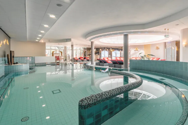 Overview of the pool area of the Grand Hotel Binz with maritime decorations and loungers, perfect for a wellness vacation on Rügen.