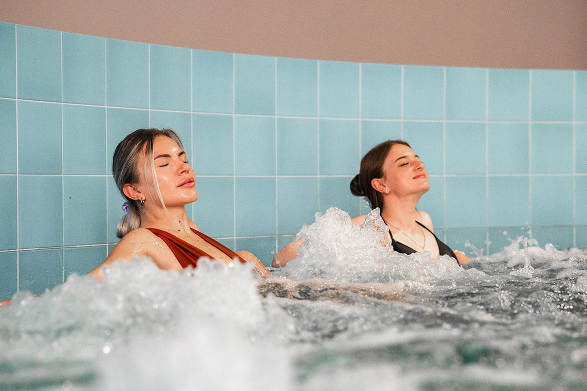 Bubble bath in spa area, guests enjoying the massage from the water